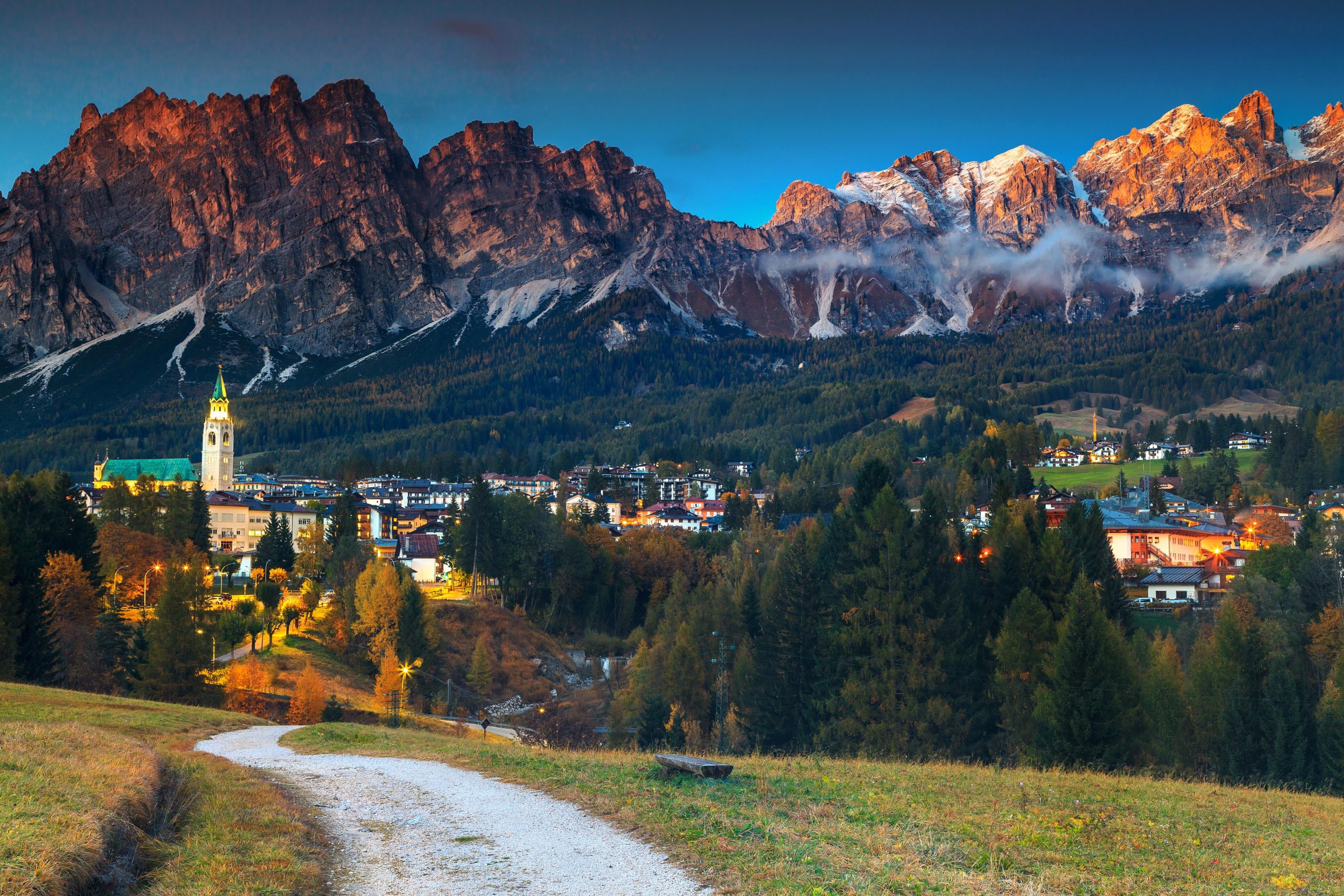 Amazing cityscape with high snowy mountains in background,Dolomites,Italy