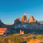 Panoramic sunrise view of Tre cime di Lavaredo mountain peaks in the Dolomites or Dolomiti, Italy