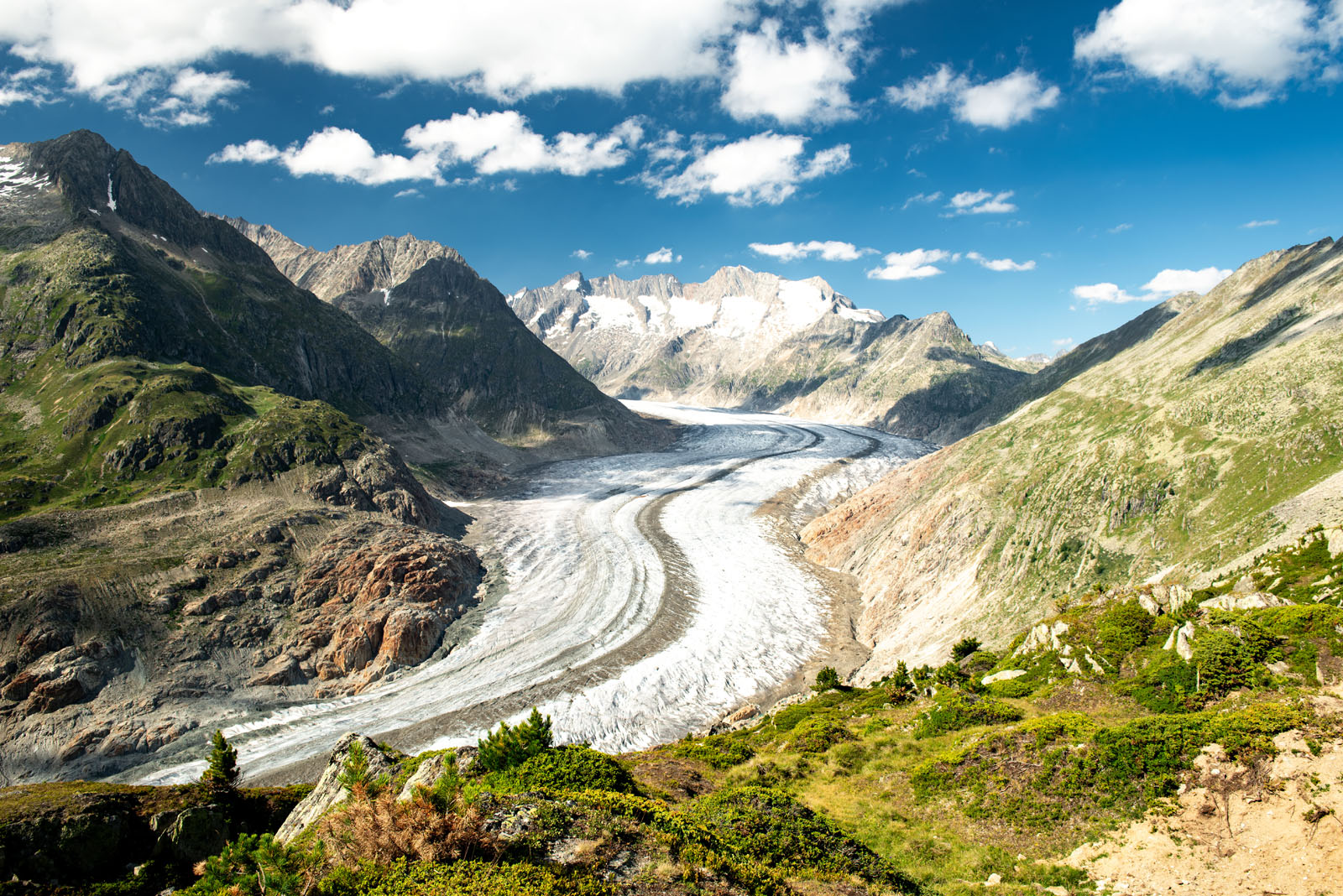Scenic view on Great Aletsch Glacier in Switzerland with blue sk