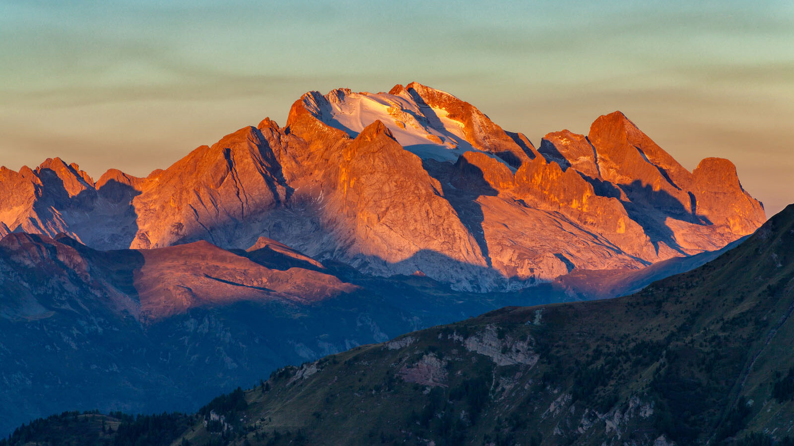 Colorful sunrise over Marmolada, the highest mountain in the Dolomites