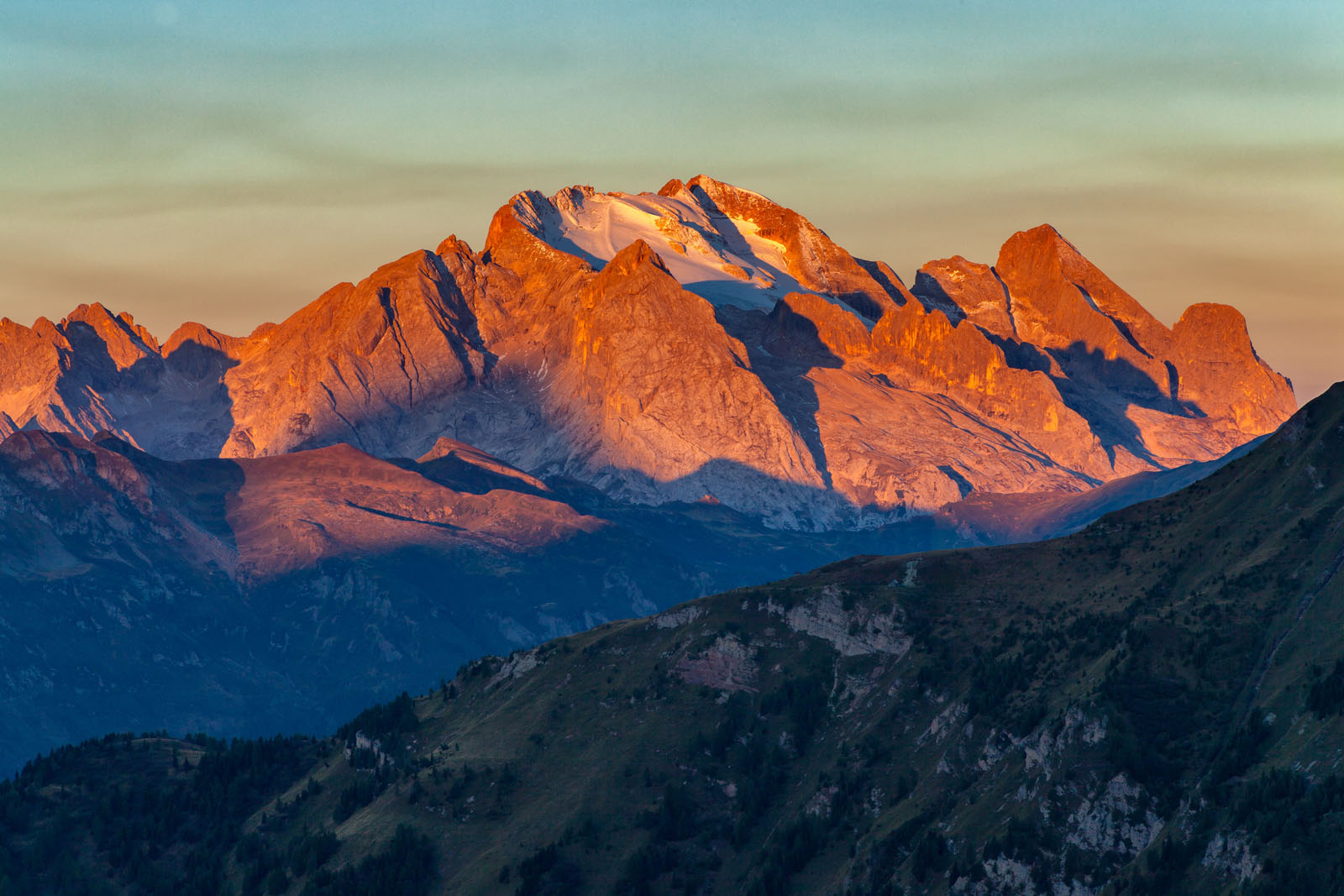 Colorful sunrise over Marmolada, the highest mountain in the Dolomites