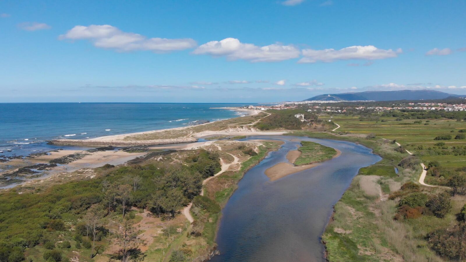 DRONE AERIAL VIEW: The mouth and estuary of Neiva River in Caste